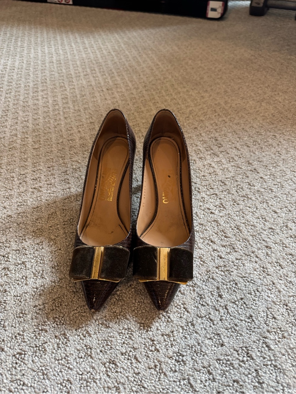 Ferragamo Pointed Toe Bow Pumps in Dark Brown with Gold Accent